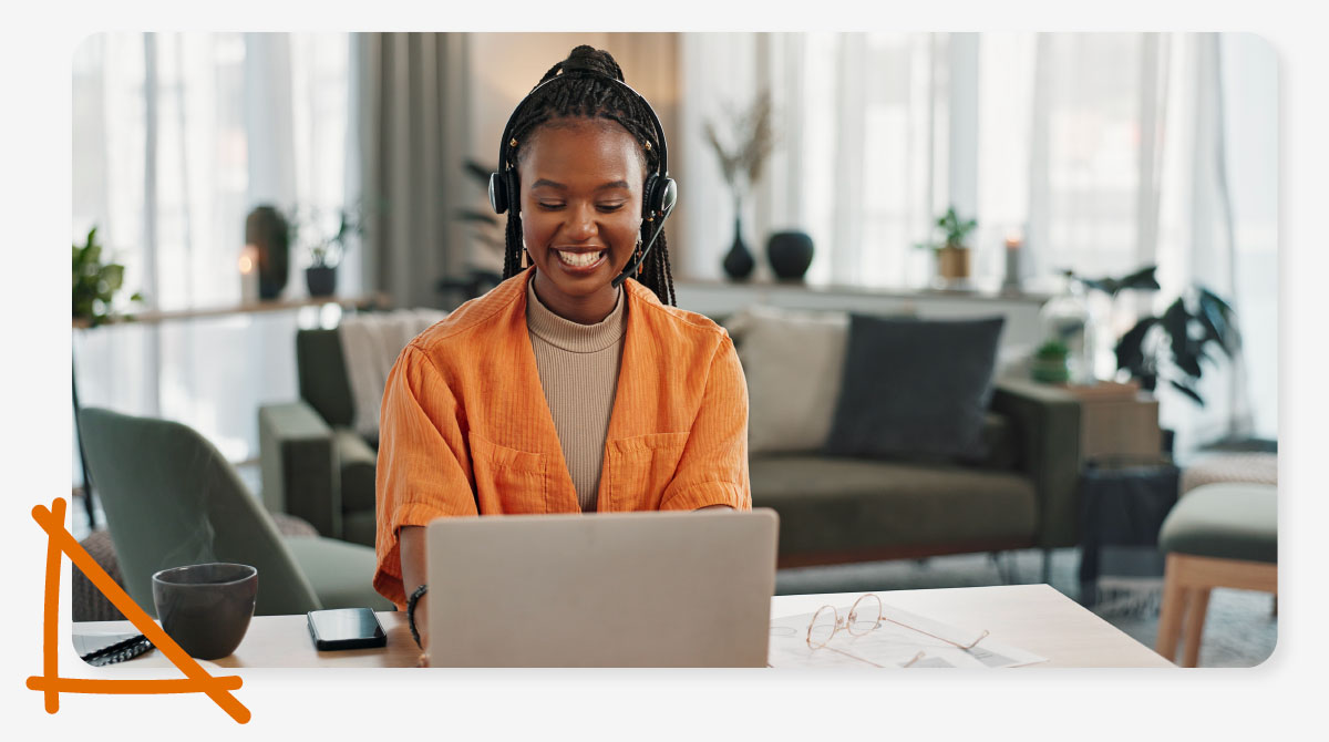 A letting agent sits at her desk super happy to be saving so much time on utility registration