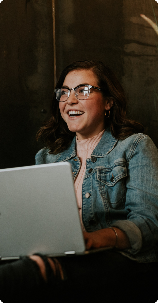 An agent at her laptop learning how to make money and save time on utility registration with Notify by One Utility Bill