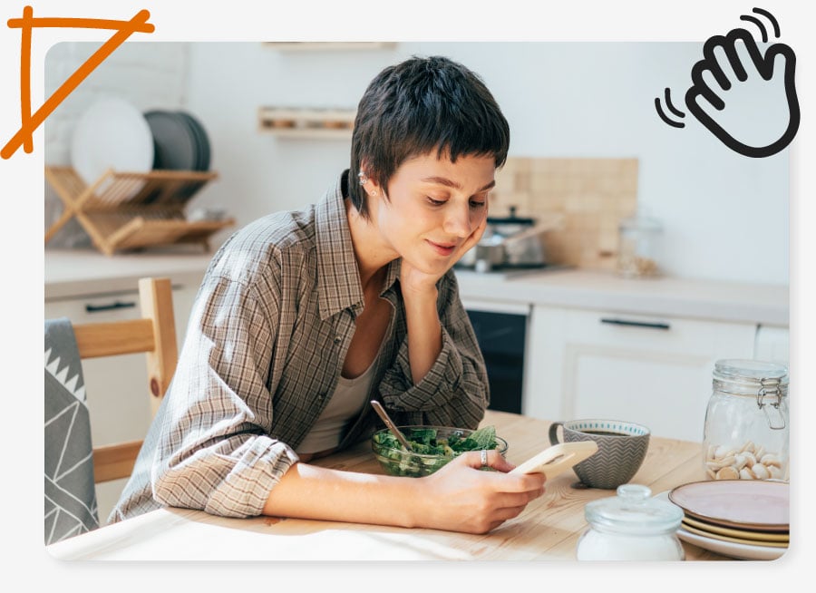 a woman sitting at her kitchen table getting an easy bills package on her mobile